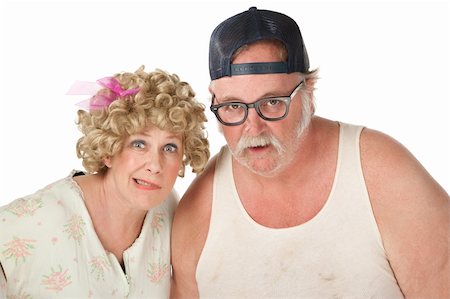 funny wig woman - Unsure homely couple looking out on white background Stock Photo - Budget Royalty-Free & Subscription, Code: 400-04185081