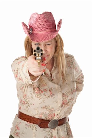 simsearch:400-04181720,k - Woman with pink cowboy hat pointing a loaded pistol Foto de stock - Royalty-Free Super Valor e Assinatura, Número: 400-04185083