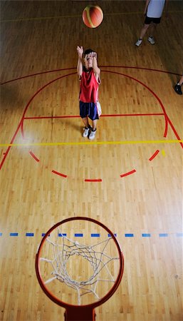 basketball game playeer shooting on basket indoor in gym Stock Photo - Budget Royalty-Free & Subscription, Code: 400-04185334
