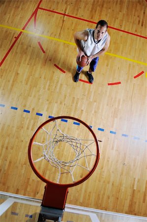 basketball game playeer shooting on basket indoor in gym Stock Photo - Budget Royalty-Free & Subscription, Code: 400-04185335