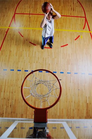 basketball game playeer shooting on basket indoor in gym Stock Photo - Budget Royalty-Free & Subscription, Code: 400-04185336