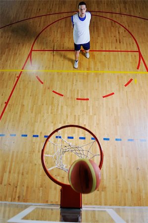 basketball game playeer shooting on basket indoor in gym Stock Photo - Budget Royalty-Free & Subscription, Code: 400-04185333
