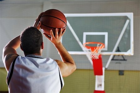 basketball game playeer shooting on basket indoor in gym Stock Photo - Budget Royalty-Free & Subscription, Code: 400-04185344