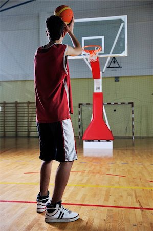 basketball game playeer shooting on basket indoor in gym Stock Photo - Budget Royalty-Free & Subscription, Code: 400-04185342