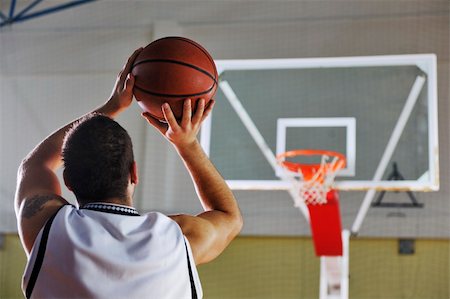 basketball game playeer shooting on basket indoor in gym Stock Photo - Budget Royalty-Free & Subscription, Code: 400-04185343
