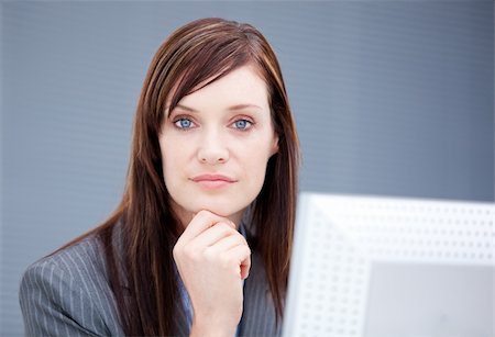 simsearch:400-04187842,k - Confident businesswoman working at a computer in the office Stock Photo - Budget Royalty-Free & Subscription, Code: 400-04185707