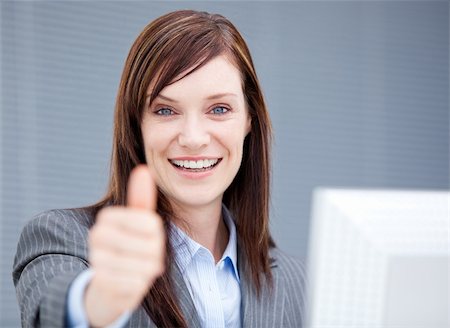 simsearch:400-04187842,k - Successful businesswoman with a thumb up in the office Stock Photo - Budget Royalty-Free & Subscription, Code: 400-04185709