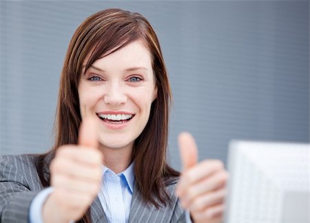 simsearch:400-04187842,k - Jolly businesswoman with thumbs up in the office Stock Photo - Budget Royalty-Free & Subscription, Code: 400-04185710
