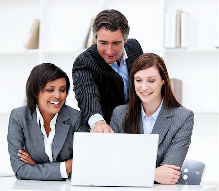 simsearch:400-04187842,k - Multi-ethnic business team working at a computer in the office Stock Photo - Budget Royalty-Free & Subscription, Code: 400-04185722