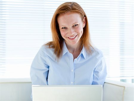 simsearch:400-04187842,k - Self-assured business woman working on a laptop computer in the office Stock Photo - Budget Royalty-Free & Subscription, Code: 400-04185737
