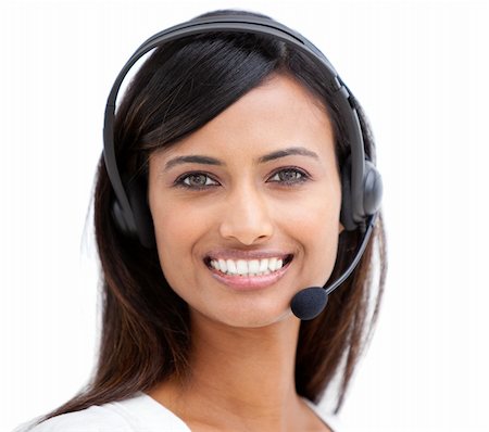 simsearch:400-03990860,k - Portrait of a beautiful ethnic businesswoman with a headset on smiling at the camera Photographie de stock - Aubaine LD & Abonnement, Code: 400-04185883