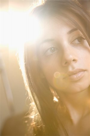 face, lens flare - Portrait of pretty young Caucasian woman. Stock Photo - Budget Royalty-Free & Subscription, Code: 400-04186429