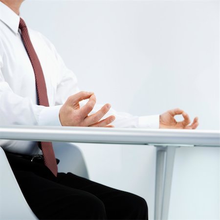 simsearch:400-04186486,k - Caucasian middle aged businessman sitting at desk in meditation. Stock Photo - Budget Royalty-Free & Subscription, Code: 400-04186472