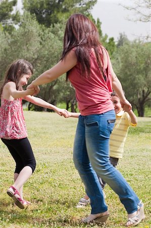 family cheerful outdoors three people running - Happy family playing in the park, outdoor Stock Photo - Budget Royalty-Free & Subscription, Code: 400-04186555