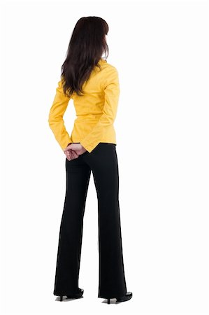 people standing white backgrounds - Young woman in yellow suit looking at wall. The rear view. Stock Photo - Budget Royalty-Free & Subscription, Code: 400-04186789