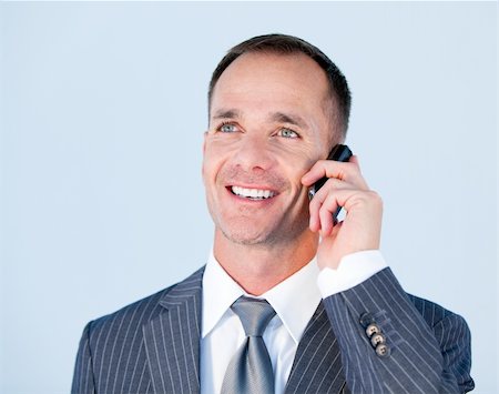 simsearch:400-04164036,k - Handsome businessman talking to the phone in the office Foto de stock - Super Valor sin royalties y Suscripción, Código: 400-04186989