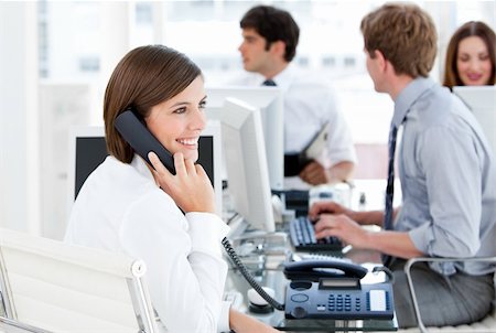 simsearch:400-04187842,k - Enthousiastic businesswoman talking to the phone in the open-space Stock Photo - Budget Royalty-Free & Subscription, Code: 400-04187026