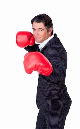 Attractive businessman wearing boxing gloves isolated on a white background Stock Photo - Budget Royalty-Free & Subscription, Code: 400-04187128