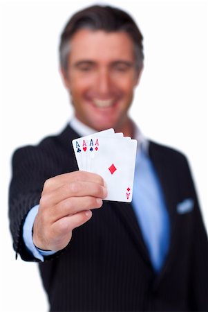 Smiling businessman holding all the aces against a white background Stock Photo - Budget Royalty-Free & Subscription, Code: 400-04187157