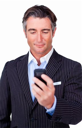 simsearch:400-05718346,k - Serious businessman sending a text against a white background Foto de stock - Super Valor sin royalties y Suscripción, Código: 400-04187151