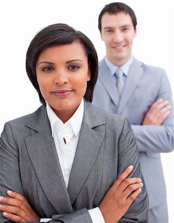 simsearch:400-04187328,k - Ethnic businesswoman posing in front of her colleague against a white background Foto de stock - Royalty-Free Super Valor e Assinatura, Número: 400-04187342