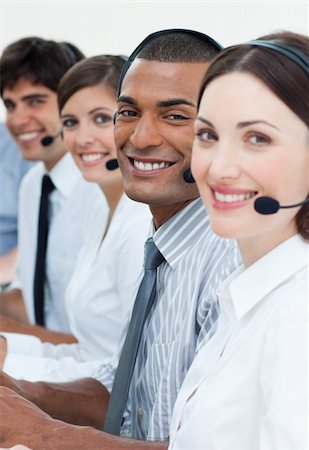 simsearch:400-04119293,k - Positive business partners with headset on working in a call center Fotografie stock - Microstock e Abbonamento, Codice: 400-04187517