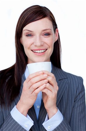 simsearch:400-04188263,k - Smiling businesswoman drinking a tea against a white background Foto de stock - Super Valor sin royalties y Suscripción, Código: 400-04187534