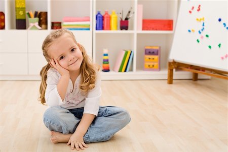 daycare on floor - Happy little girl in her room sitting on the floor smiling Stock Photo - Budget Royalty-Free & Subscription, Code: 400-04187566