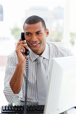 simsearch:400-05900712,k - Attractive businessman on phone in the office Stock Photo - Budget Royalty-Free & Subscription, Code: 400-04187628