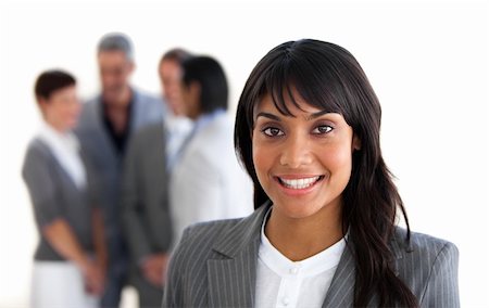 simsearch:400-06567931,k - Focus on a smiling manager with her team in the background Stock Photo - Budget Royalty-Free & Subscription, Code: 400-04187687