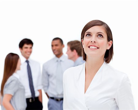 simsearch:400-06567931,k - Young businesswoman looking up in front of her colleagues against a white background Stock Photo - Budget Royalty-Free & Subscription, Code: 400-04187683