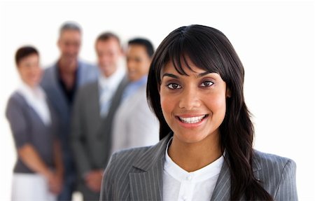 simsearch:400-06567931,k - Focus on an ethnic young manager with her team in the background Stock Photo - Budget Royalty-Free & Subscription, Code: 400-04187691