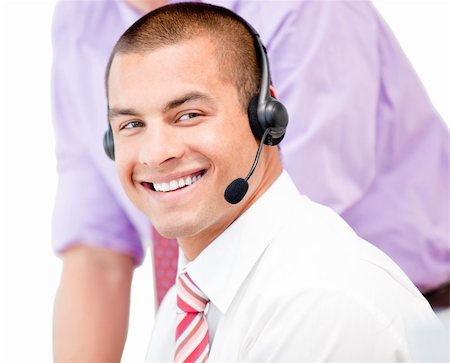simsearch:400-04188205,k - Portrait of a smiling businessman with headset on against white background Stock Photo - Budget Royalty-Free & Subscription, Code: 400-04187786