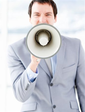 simsearch:400-04126489,k - Portrait of a stressed businessman using a megaphone in the office Stock Photo - Budget Royalty-Free & Subscription, Code: 400-04187789