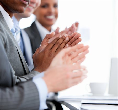 simsearch:400-05710385,k - Close up of a  mixed business team applauding a presentation in the office Foto de stock - Royalty-Free Super Valor e Assinatura, Número: 400-04187833