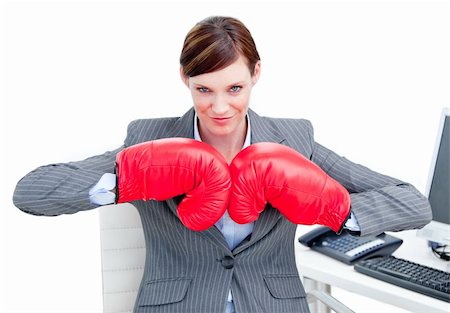 simsearch:400-05898249,k - Confident businesswoman preparing to fight with boxing gloves in the office Stock Photo - Budget Royalty-Free & Subscription, Code: 400-04187845