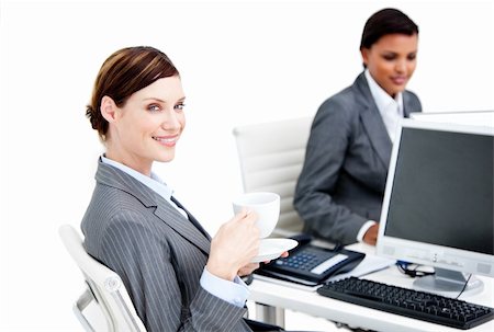 simsearch:400-04341796,k - Smiling female business partners having a break drinking coffee in the office Stockbilder - Microstock & Abonnement, Bildnummer: 400-04187842