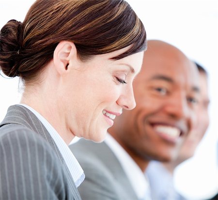 simsearch:400-05710385,k - Portrait of smiling businesswoman during a presentation against a white background Foto de stock - Royalty-Free Super Valor e Assinatura, Número: 400-04187858