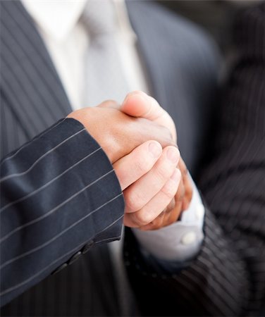 simsearch:400-08289045,k - Handshake between two businessmen in the office Stock Photo - Budget Royalty-Free & Subscription, Code: 400-04187862