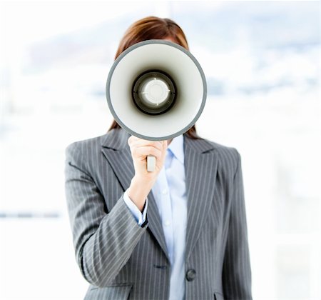 simsearch:400-04126489,k - Portrait of an confident businesswoman using a megaphone in the office Stock Photo - Budget Royalty-Free & Subscription, Code: 400-04187879