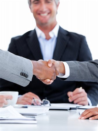 simsearch:400-08289045,k - Close-up of a handshake between two businesspeople in front of the boss in the office Stock Photo - Budget Royalty-Free & Subscription, Code: 400-04187880