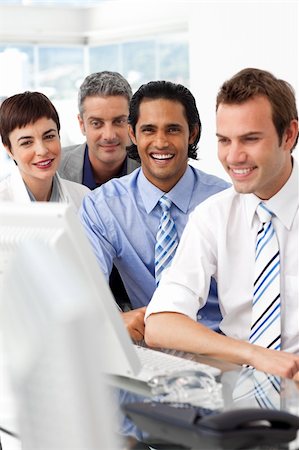 simsearch:400-05009097,k - Smiling international business partners sitting together in the office Stock Photo - Budget Royalty-Free & Subscription, Code: 400-04187894