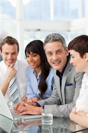 simsearch:400-05009097,k - Multi-ethnic business partners sitting together in the office Stock Photo - Budget Royalty-Free & Subscription, Code: 400-04187895