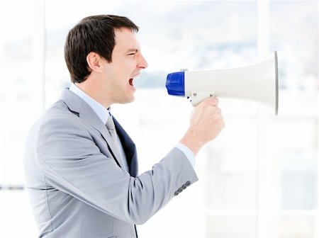 simsearch:400-04126489,k - Portrait of an pretty businessman using a megaphone in the office Stock Photo - Budget Royalty-Free & Subscription, Code: 400-04187891
