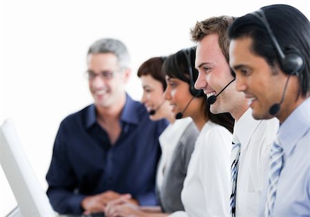 simsearch:400-04119293,k - Positive business partners with headset on working in a call center Fotografie stock - Microstock e Abbonamento, Codice: 400-04187959