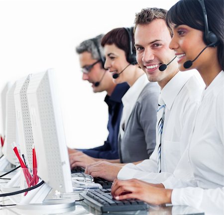 simsearch:400-04119293,k - Positive business partners with headset on working in a call center Fotografie stock - Microstock e Abbonamento, Codice: 400-04187953