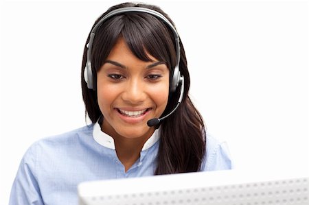 simsearch:400-04472832,k - Positive ethnic customer service representative using headset in a call center Stock Photo - Budget Royalty-Free & Subscription, Code: 400-04187971