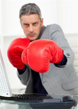 simsearch:400-07313485,k - Businessman beating the competition in the office Stock Photo - Budget Royalty-Free & Subscription, Code: 400-04187987