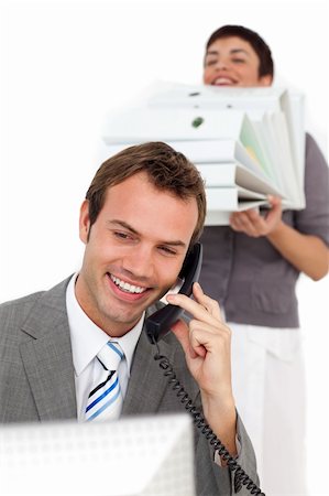 suited person holding paper up - Businesswoman bringing a stack of folders to her colleague in the office Stock Photo - Budget Royalty-Free & Subscription, Code: 400-04188045