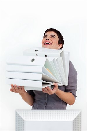 suited person holding paper up - Laughing businesswoman carrying a pile of folders against a white background Stock Photo - Budget Royalty-Free & Subscription, Code: 400-04188047